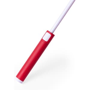 A red handle of an umbrella with a white shaft, featuring a button and a simple design.