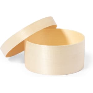 A round wooden gift box in light wood tone, with a removable lid. The interior is smooth and unblemished.