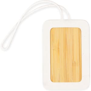 A luggage tag in white with a bamboo section for information, featuring a loop for attachment.