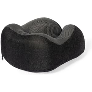 A black and grey Blaiser Pillow with a curvy, ergonomic design and a textured fabric finish.