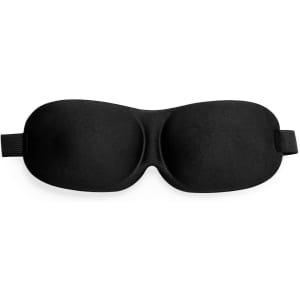 A black travel eye mask with a padded design and an adjustable strap, featuring a logo.