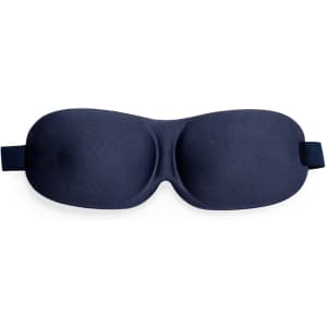 A navy blue travel eye mask with a smooth surface and elastic band, featuring a logo on one side.