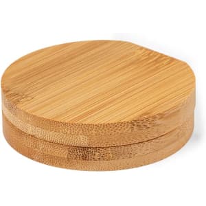 A set of round bamboo coasters stacked together, showcasing a smooth and natural wood finish.