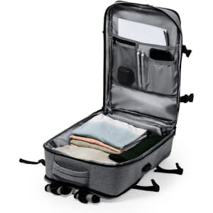 A grey Myriax backpack with an open compartment displaying neatly folded clothing and pockets for organisation.