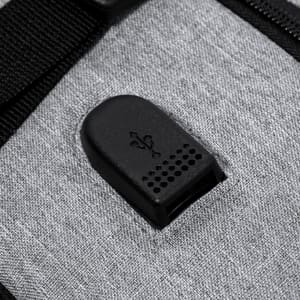 A grey Myriax Backpack featuring a USB port on the exterior, with a textured black panel.