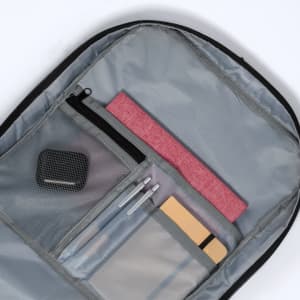 A grey Myriax Backpack interior featuring a pink element, pens, and a mesh pocket with a closed zip.
