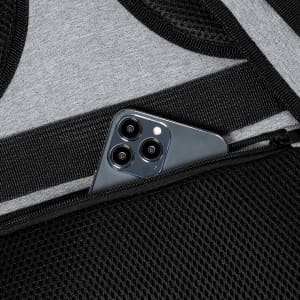 A smartphone rests in a mesh pocket of a black and grey Myriax Backpack, showcasing its sleek design.