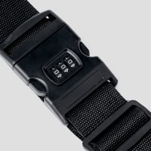 A black luggage strap with a combination lock and adjustable buckle, made from durable webbing material.