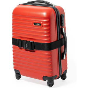 A red suitcase with black luggage strap and wheels, featuring a handle and a logo.