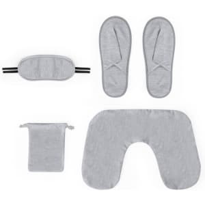 A grey travel set including a neck pillow, eye mask, slippers, and a small pouch. The items feature a soft fabric.