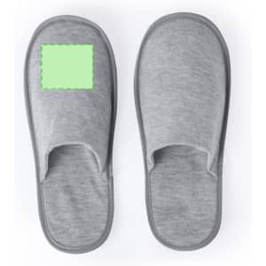 A pair of grey slippers with an empty space for branding. Soft and comfortable design.