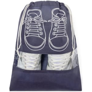 A navy shoe bag featuring a white sneaker graphic and a transparent section displaying white shoes inside.