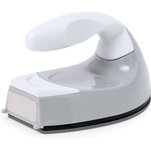 A grey and white handheld iron with a smooth design and a large handle, featuring a branding logo.