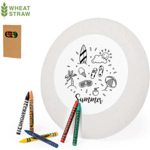 A round Frisbee in light grey with a summer-themed design, accompanied by a box of colourful crayons.