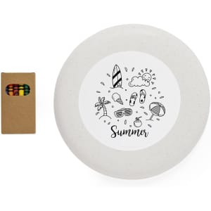An ash-grey frisbee with a beach-themed illustration and a small box of coloured crayons beside it.