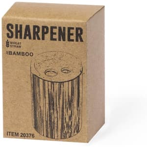 A brown cardboard box containing a bamboo pencil sharpener. The box has a simple design and features a logo.
