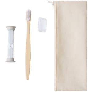 A wooden toothbrush, an hourglass timer, a toothbrush cover, and a beige storage pouch.