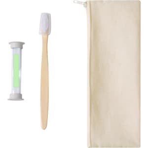 A bamboo toothbrush, a small tube, and a natural-coloured storage pouch. The tube contains green contents.