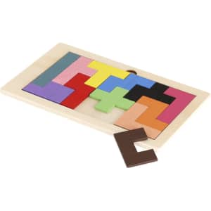 A wooden puzzle featuring various coloured geometric shapes in a tray, with one brown piece placed beside it.
