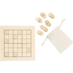 A wooden Sudoku board with a grid and circular tokens scattered beside a small drawstring bag.