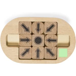 A wooden puzzle featuring nine blocks with arrow designs, arranged in an oval base. It includes a small segment of green detail.