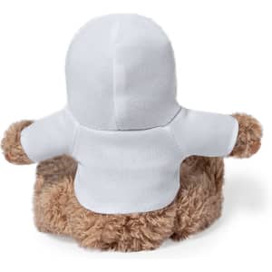 A plush teddy bear with a brown fluffy body and a white hooded outfit, featuring a logo on the garment.