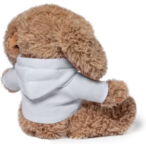 A plush teddy bear with fluffy brown fur wearing a white hoodie, positioned to show its back.