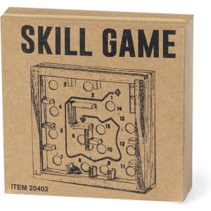 A cardboard box containing a wooden skill game featuring a maze design with numbered pathways and game elements.