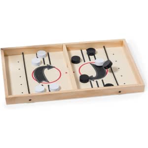 A wooden board game featuring black and white pieces arranged on a divided surface with arrows and lines.