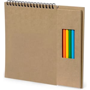 A spiral-bound notebook with a kraft cover and five coloured pencils in a side pocket, featuring orange, yellow, green, and blue.