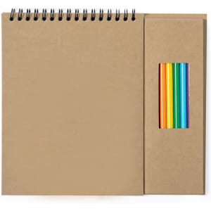 A sketchbook with a spiral binding and a side compartment containing coloured pencils in various shades.