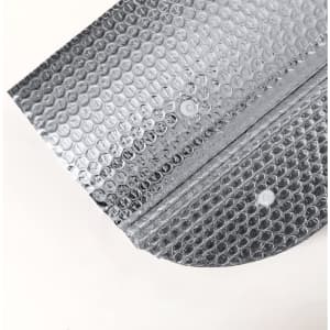 A silver sunshade made of bubble wrap material, featuring a curved edge and a small hole.