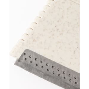 A light-coloured ice scraper keyring featuring a textured scraping edge and a smooth handle. It includes a branding logo.