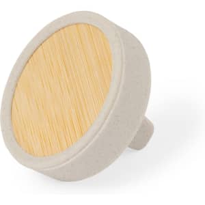 A round air freshener with a natural bamboo top and a light grey base, featuring a simple design.