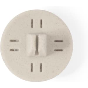 A round, beige air freshener with multiple holes for fragrance dispersion and a simple logo.