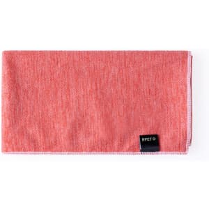 A coral absorbent towel with a textured pattern and a visible logo, designed for leisure and outdoor activities.
