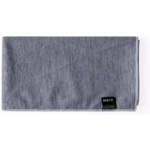 A grey absorbent towel with a textured surface and a small branding label on one side.