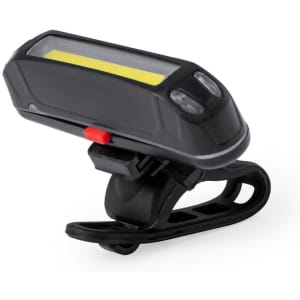 A black bike safety light with a yellow lens and a mounting clip. It has two buttons on the front.