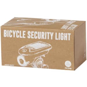 A cardboard box containing a bicycle safety light, featuring an illustration and a logo on the surface.