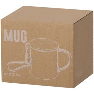 A cardboard box containing a travel mug, featuring a handle and a logo, in a plain design.