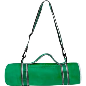 A green picnic blanket rolled up and secured with straps, featuring a carry handle and adjustable shoulder strap.