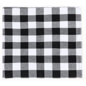 A black and white checkered picnic blanket featuring alternating squares of solid black and grey.