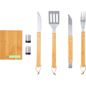 A barbecue set featuring stainless steel tools with bamboo handles, including a knife, spatula, tongs, and fork, plus a bamboo cutting board.