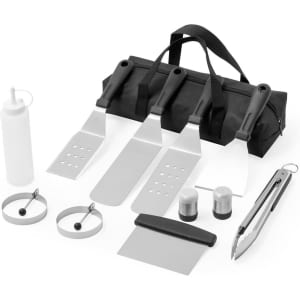 A black barbecue bag containing a set of stainless steel grilling tools, including spatulas, tongs, a scraper, and more.