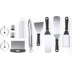 A barbecue set featuring stainless steel tools in black, including tongs, spatulas, and condiment bottles, with a logo.