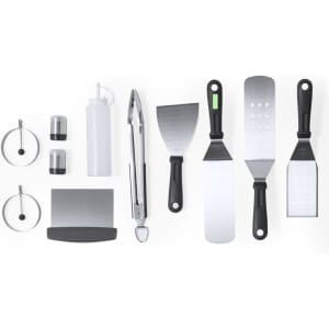 A barbecue set featuring various tools including tongs, spatulas, and a drink bottle, primarily in black and silver.
