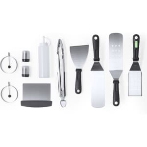 A barbecue set featuring stainless steel spatulas, tongs, a bottle, seasoning shakers, and a scraper in black and silver.