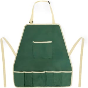 A green gardening apron featuring a front pocket and multiple tool slots, with cream-coloured straps.