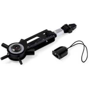 A black multitool with adjustable components and a measuring ruler, accompanied by a small black accessory.