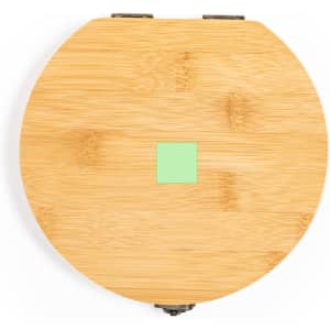 A round bamboo tool set with a green accent, featuring a hinged lid and a natural wood finish.